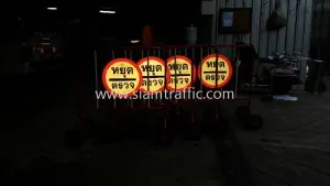 Crowd barrier with reflective stop check sign
