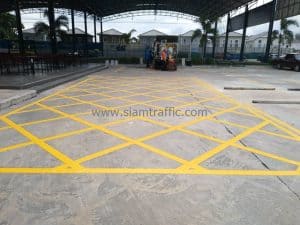 Yellow pavement markings at Winning Seven Soccer Club 1